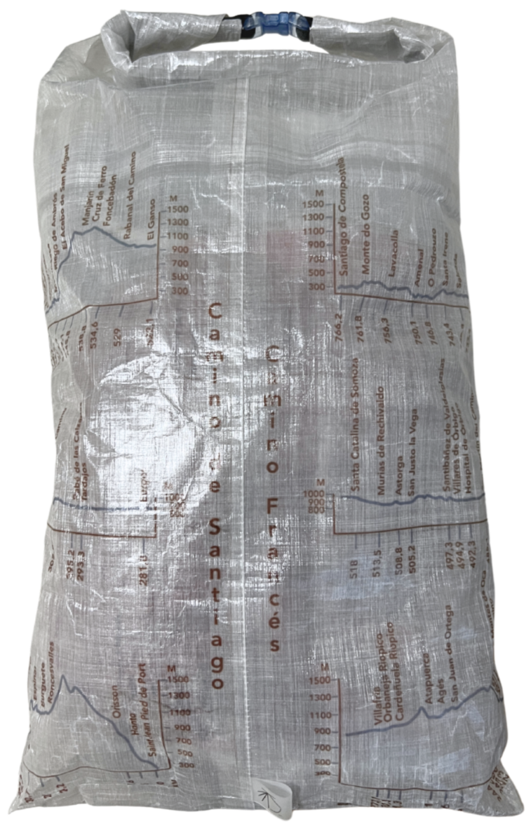 Camino de Santiago Dyneema® Clear Large Rolltop bag with Ultreiatrek design of all the towns and kilometers on the Camino Frances. Gradient is pictured in blue and names are in brown. Front view.