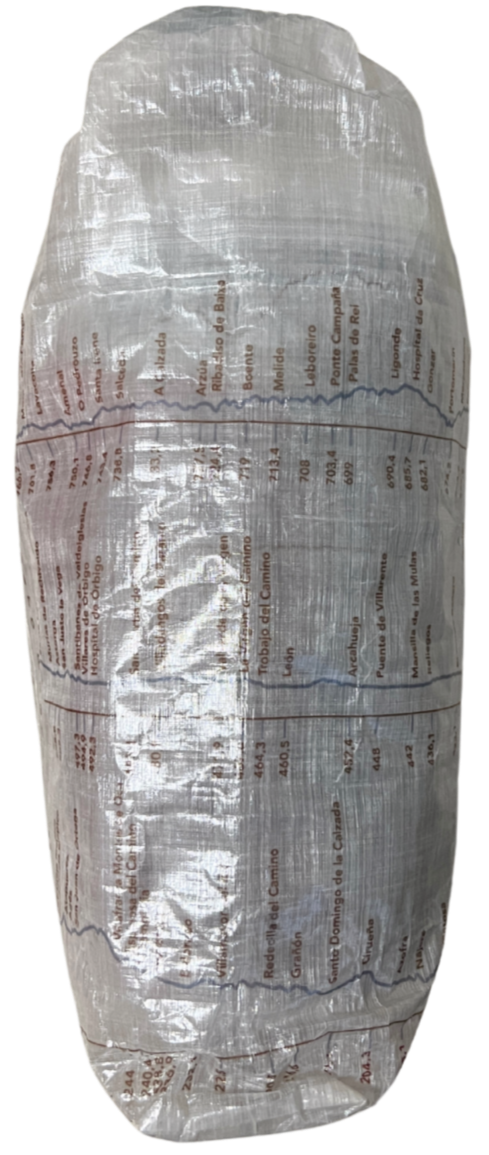 Camino de Santiago Dyneema® Clear Large Rolltop bag with Ultreiatrek design of all the towns and kilometers on the Camino Frances. Gradient is pictured in blue and names are in brown. Side View.