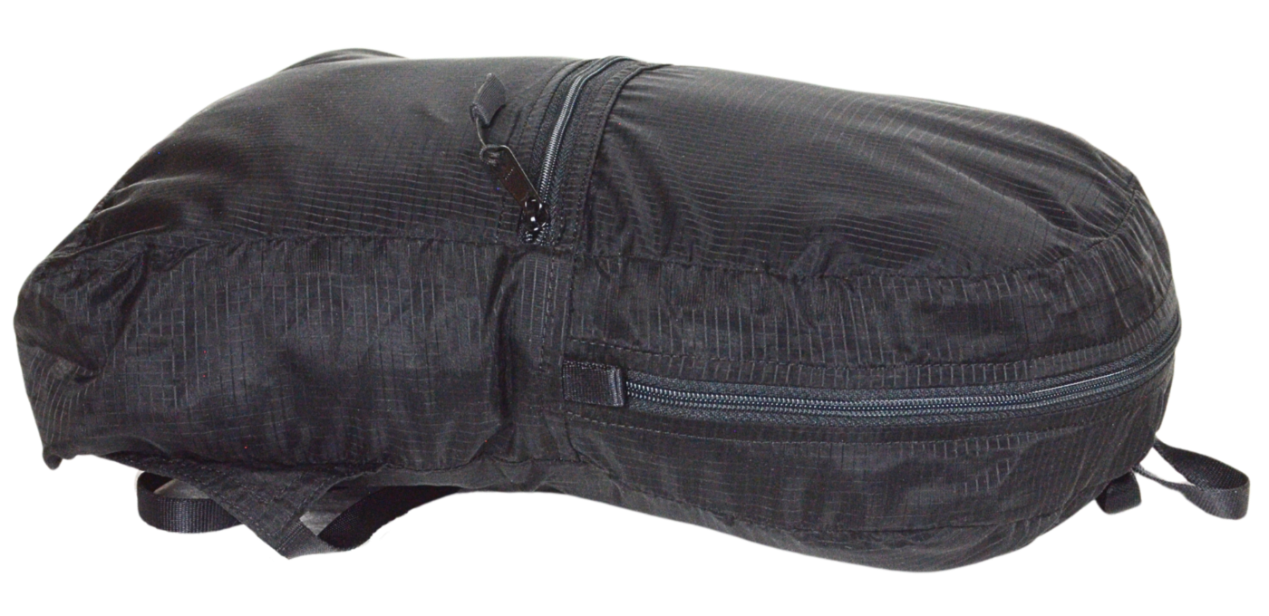 Side View of the unisex MINImalist backpack. It is black in color and made of sheer nylon fabric.