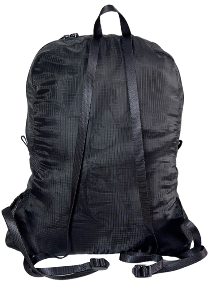 Back side of the unisex MINImalist backpack. It is black in color and made of sheer nylon fabric. 