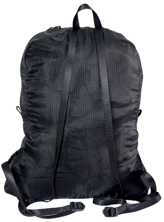 Back side of the unisex MINImalist backpack. It is black in color and made of sheer nylon fabric. 