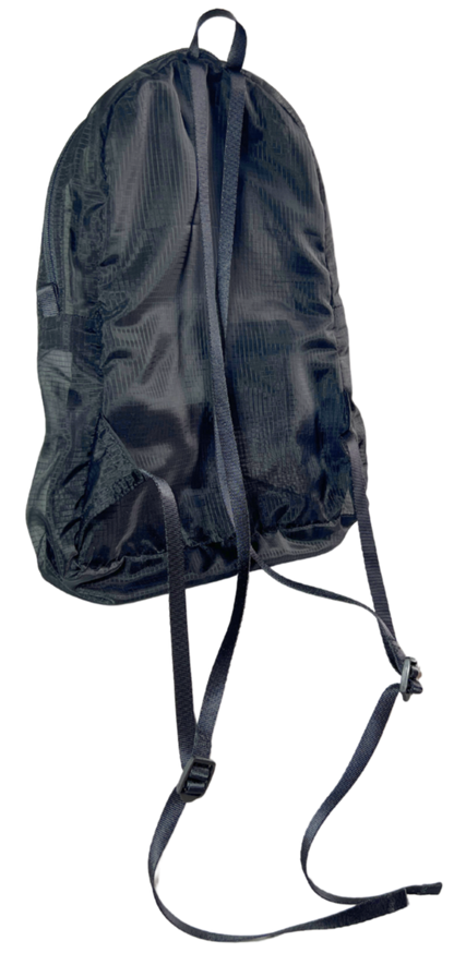 Back of the unisex MINImalist backpack. It is black in color and made of sheer nylon fabric. Backpack is empty.