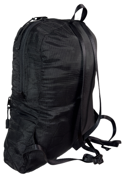 Side view of the unisex MINImalist backpack. It is black in color and made of sheer nylon fabric. 